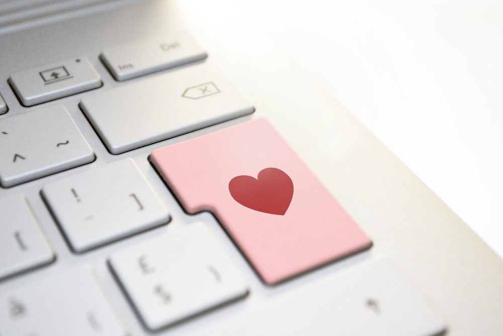 A pink Enter key on a keyboard with a heart icon in the center