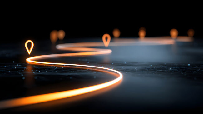 strategic-business-vision-hero Glowing pathway with illuminated markers showing a clear strategic vision direction forward in a dark environment.