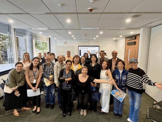 Ethical AI for Community Grants – Learning in Action Participants gathered at the Institute of Excellence Ethical AI Community Grants workshop, smiling and celebrating shared learning in responsible AI use.